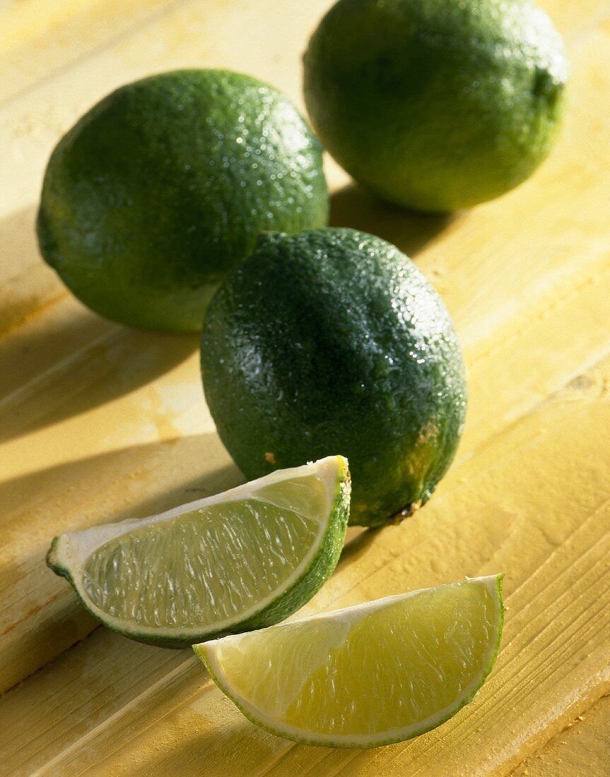 Lime and lime wedges (citrus aurantiifolia)