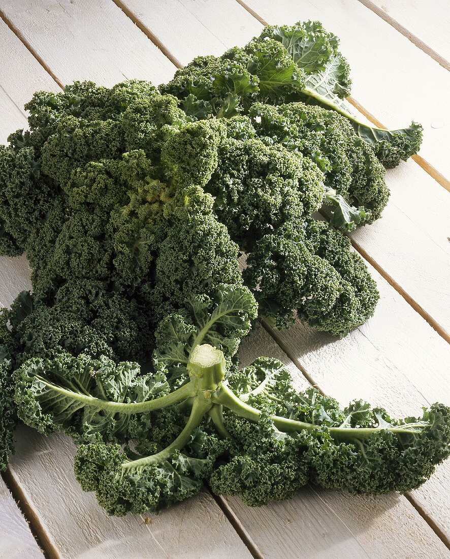 Kale on wooden background