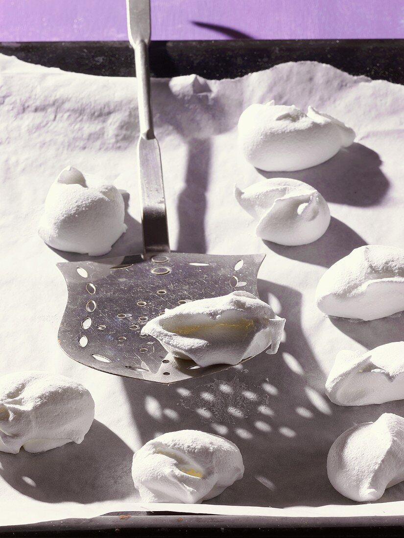 'Spanish wind' (hemispherical meringues) on baking tray