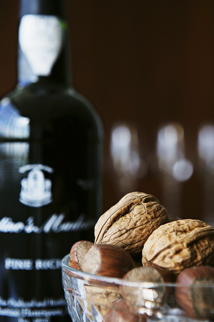 Walnuts, hazelnuts and bottle of Madeira