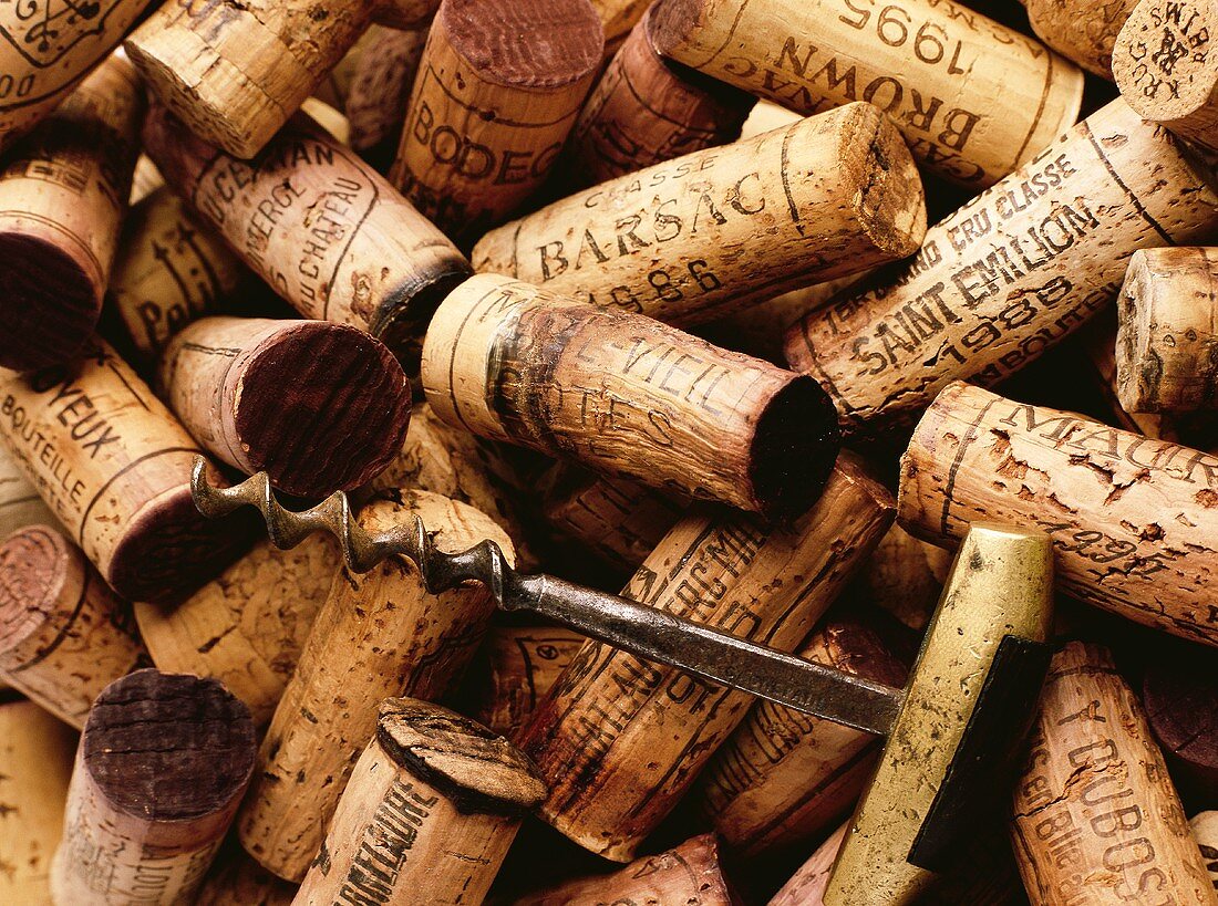 Various wine corks and old corkscrew