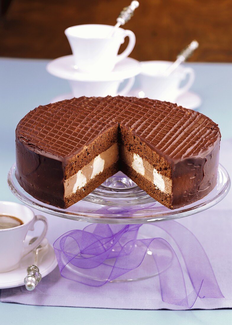 Chocolate cream gateau, a piece cut