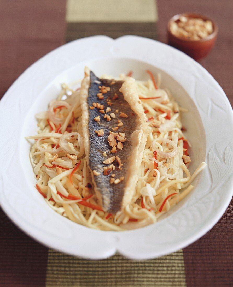 Fried fish on mango salad (Thailand)