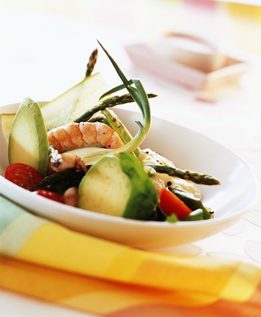 Vegetable salad with avocado, asparagus and shrimps