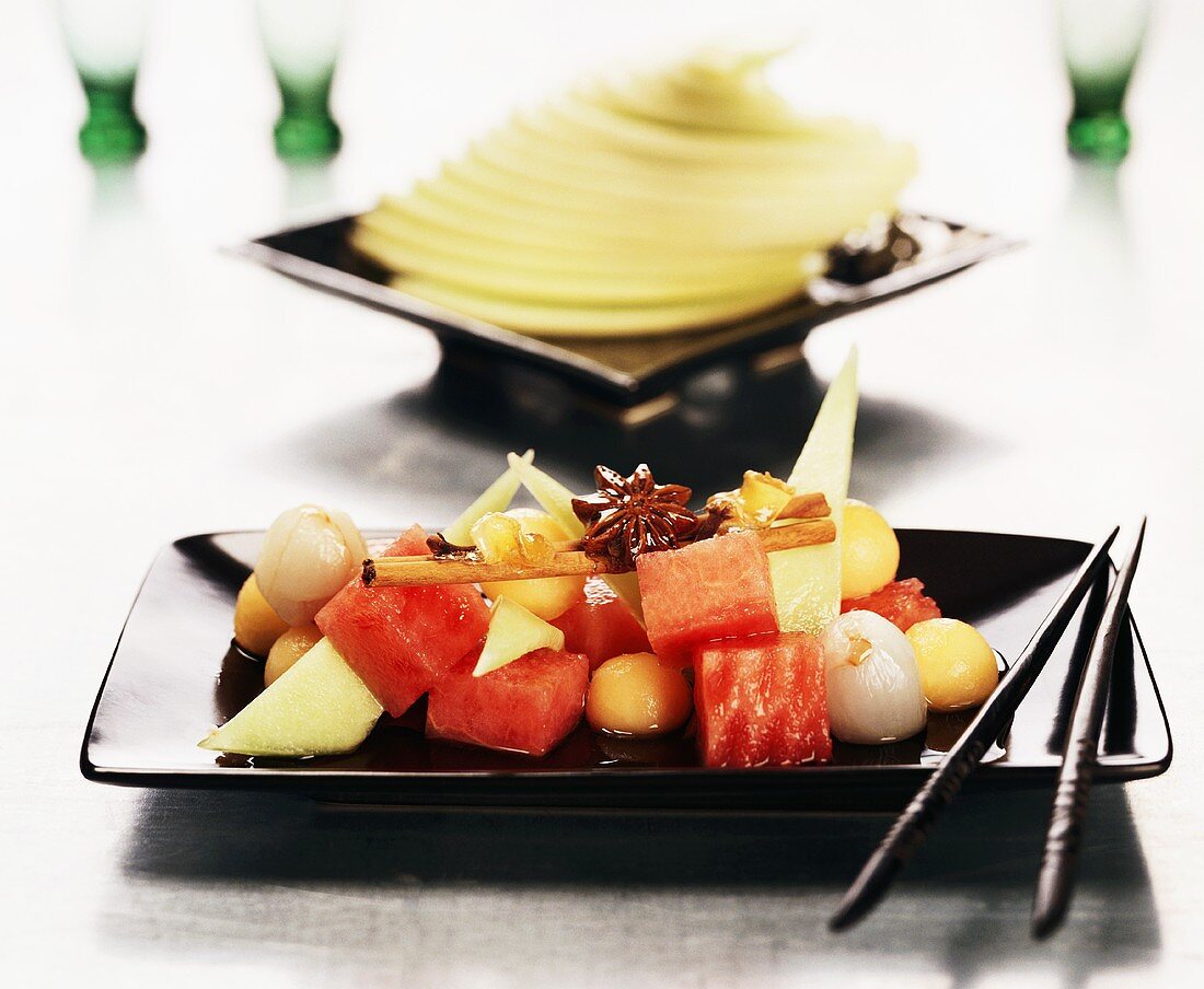 Exotic fruit salad with star anise and cinnamon stick