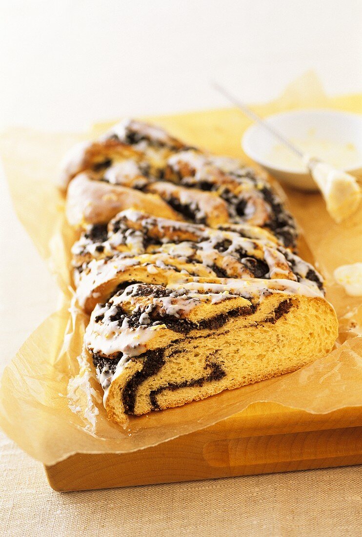 Poppy seed plait with glacé icing