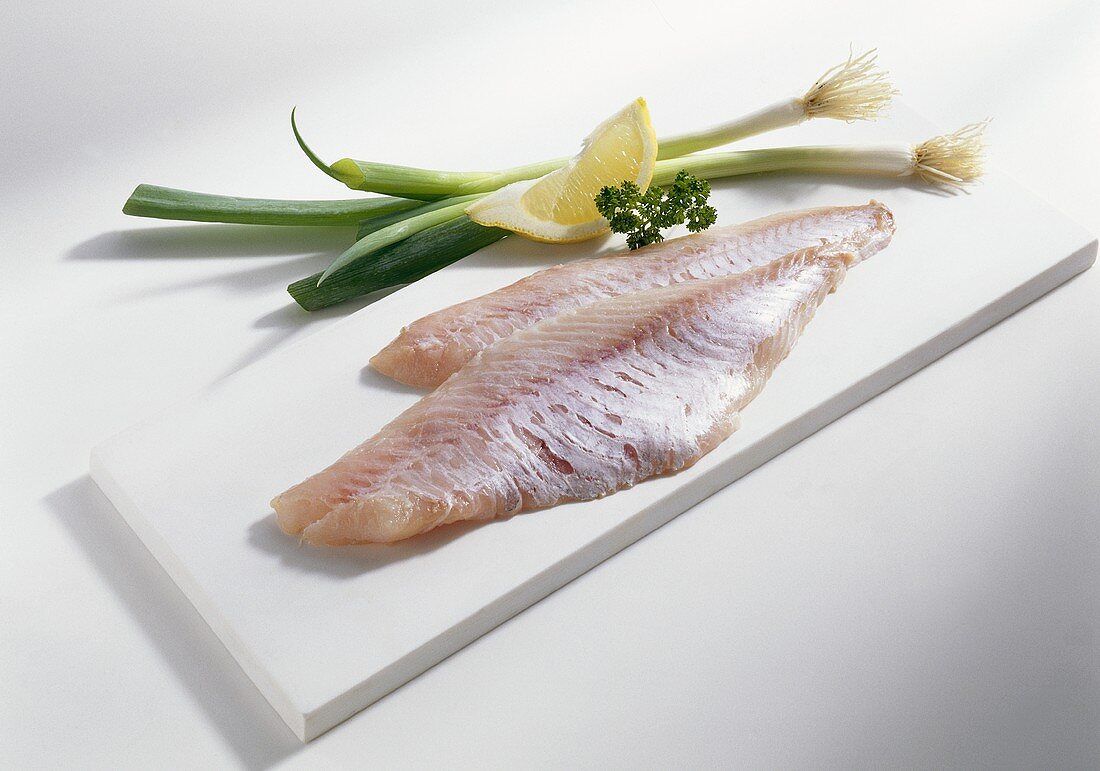 Redfish fillets on chopping board