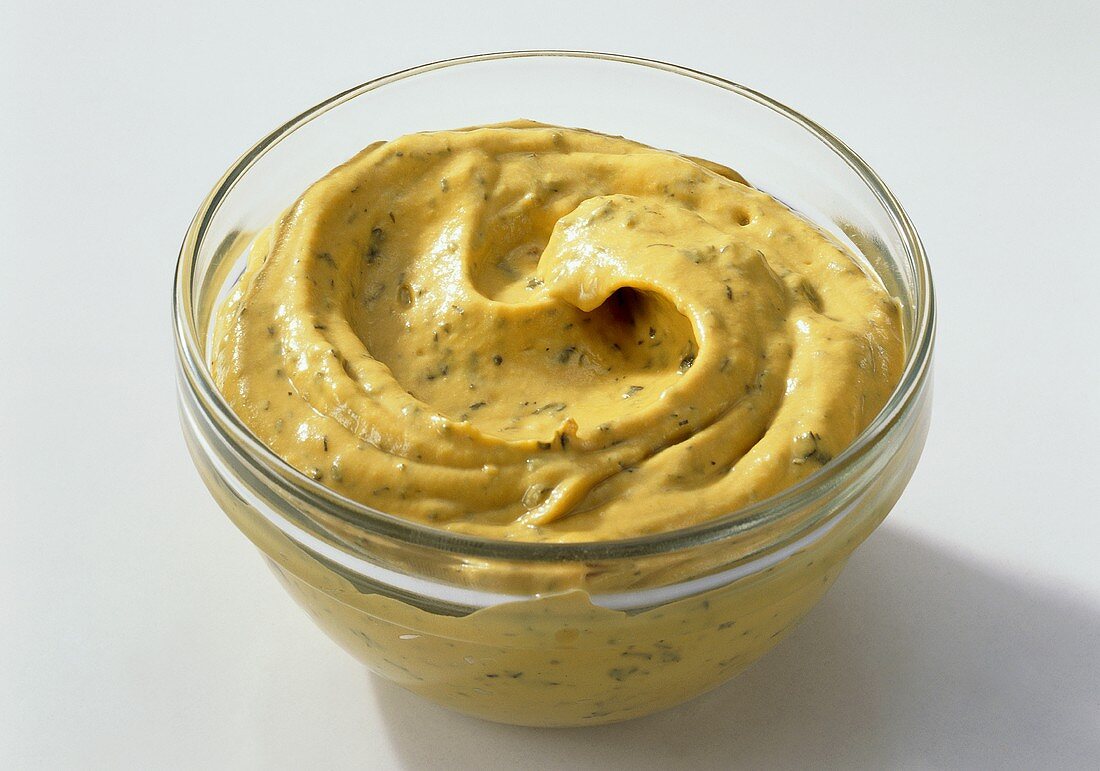 Herb mustard in glass bowl