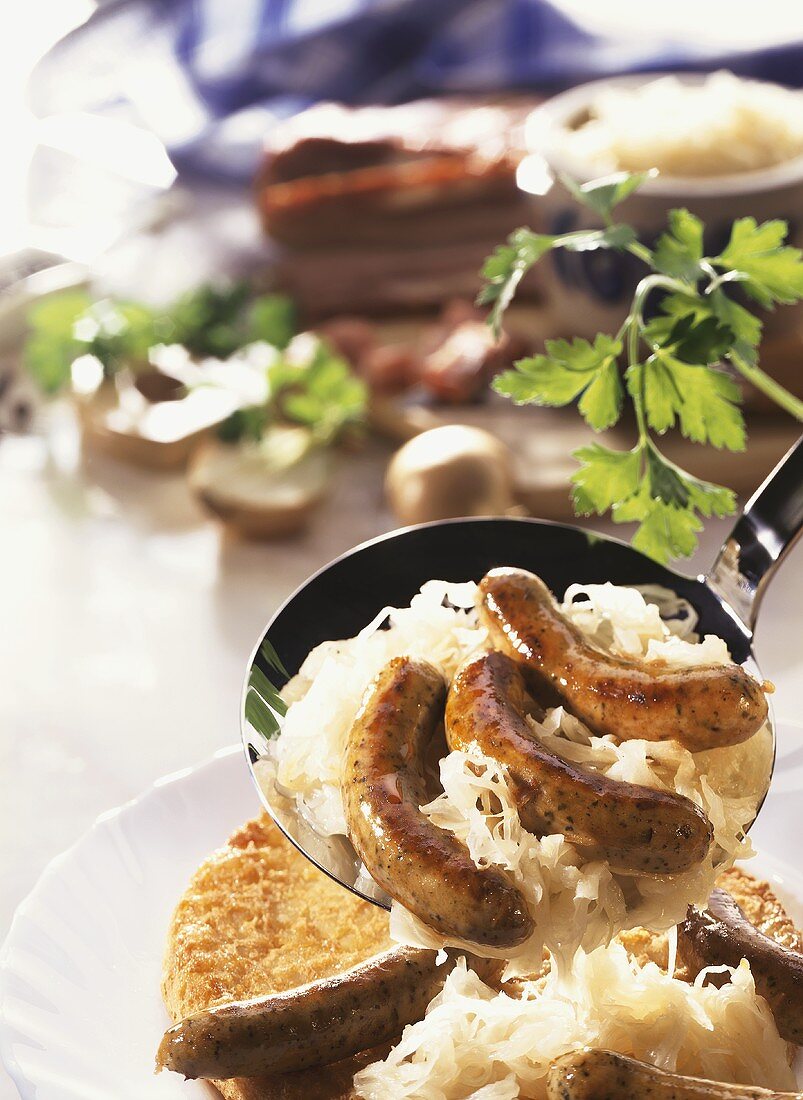 Sausages with sauerkraut and potato pancake