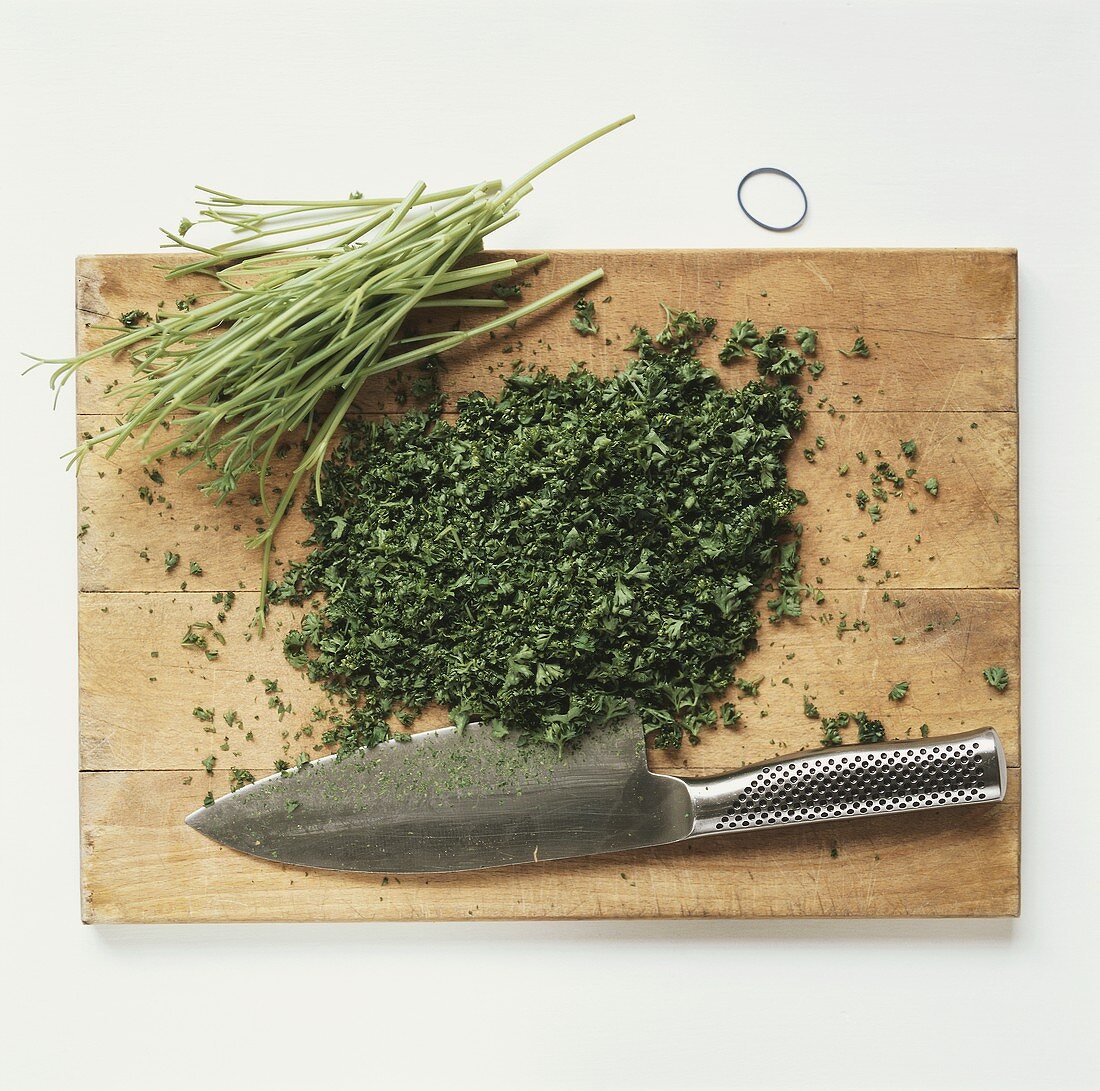 Chopped parsley on chopping board