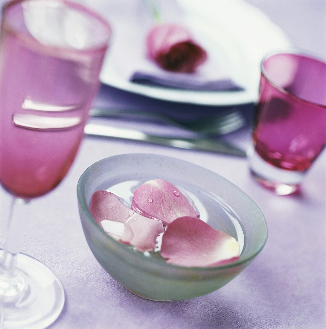 Bowl of water with rose petal (table decoration)
