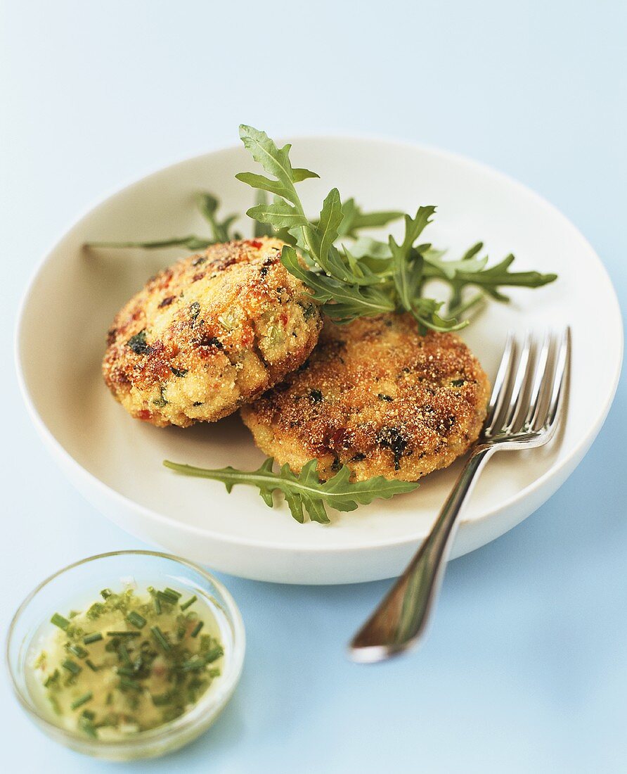 Salmon cakes with rocket and mayonnaise