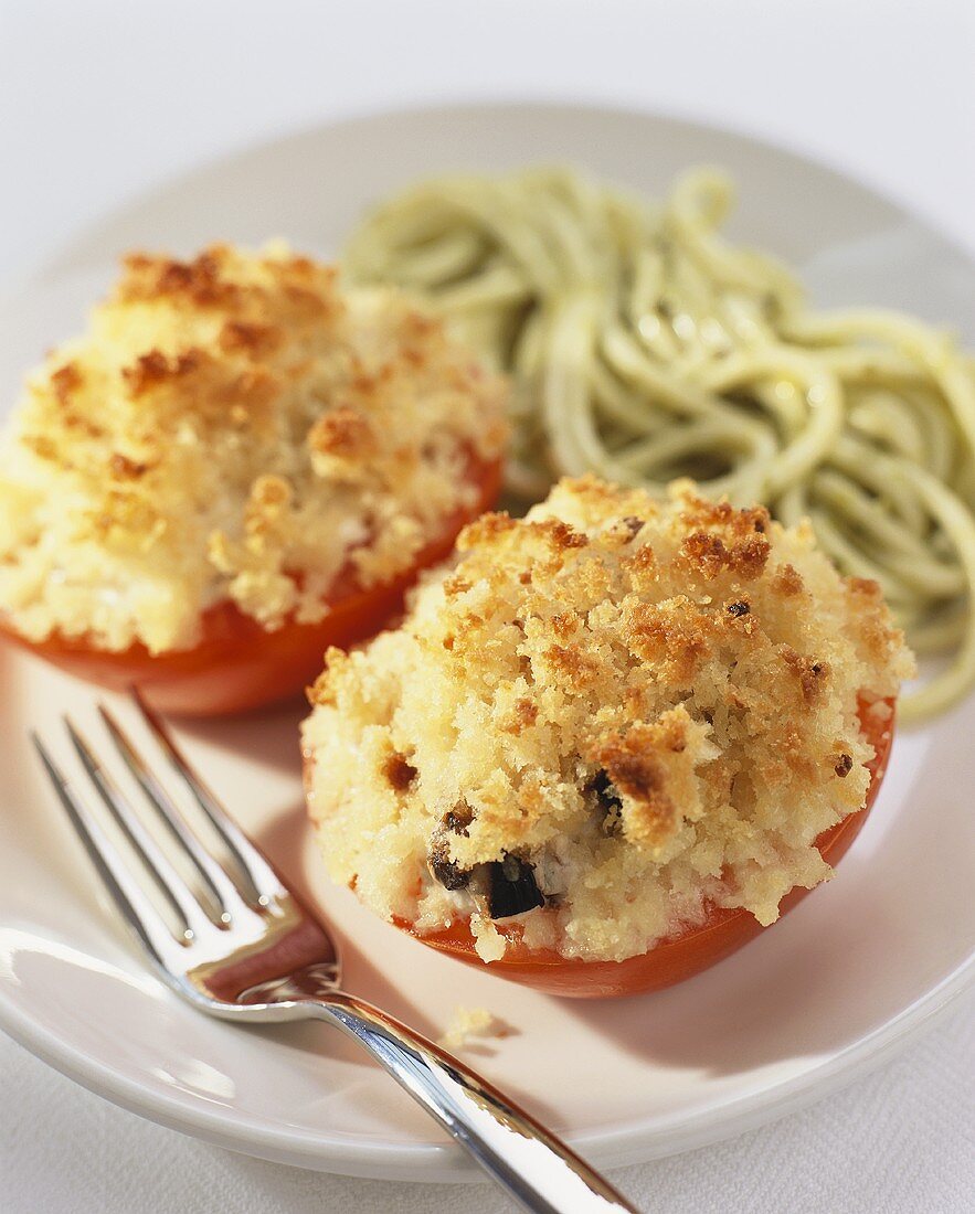 Stuffed tomatoes with green pasta