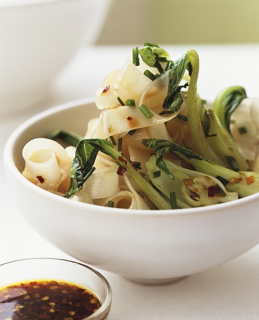 Wide ribbon pasta with pak choi and chili sauce