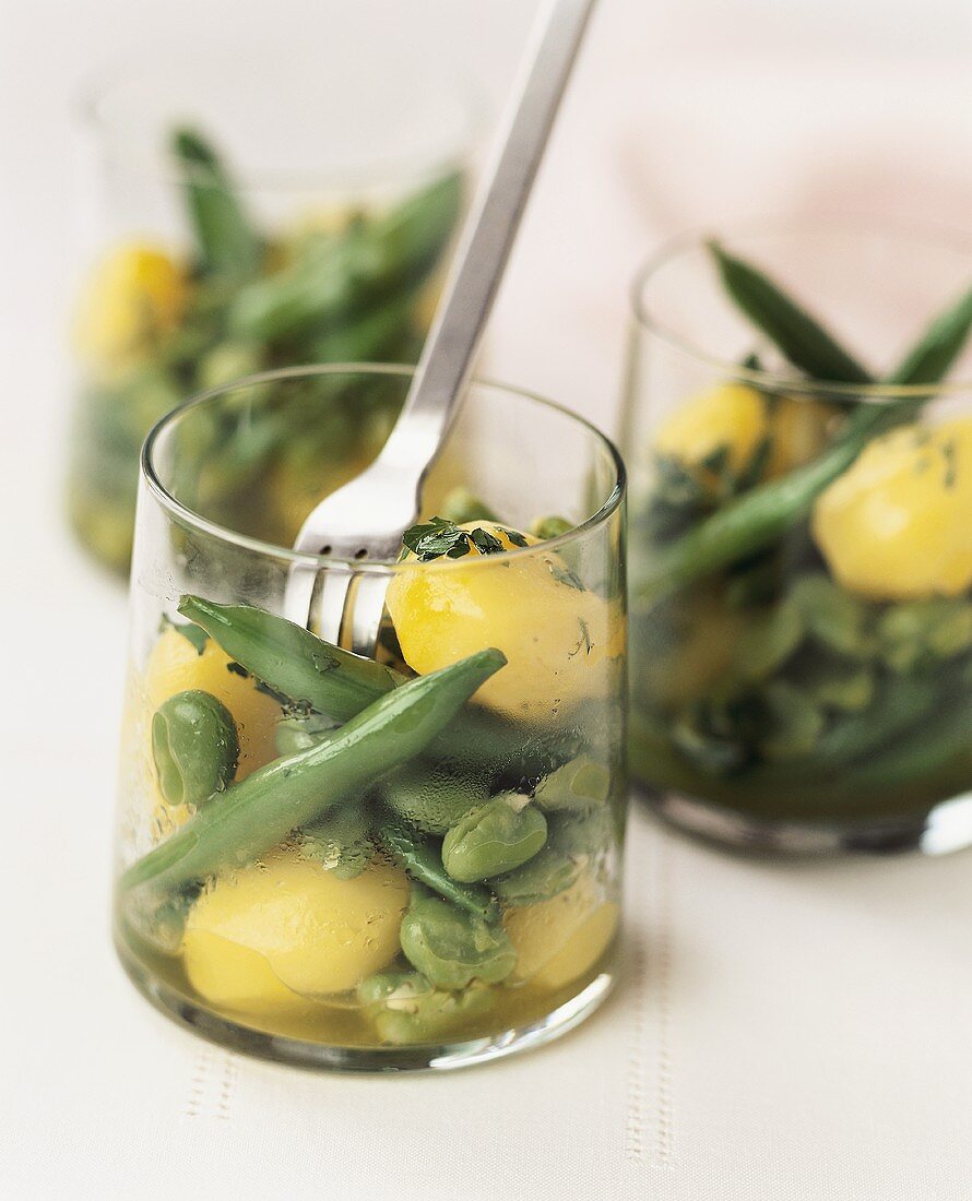 Saffron potato and bean salad in three glasses