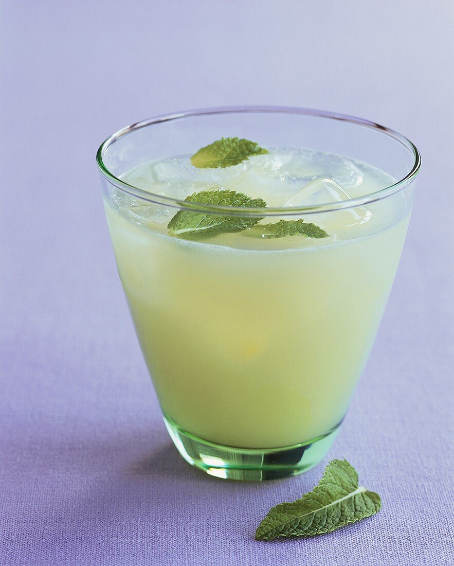 Lemon drink with mint and ice cubes