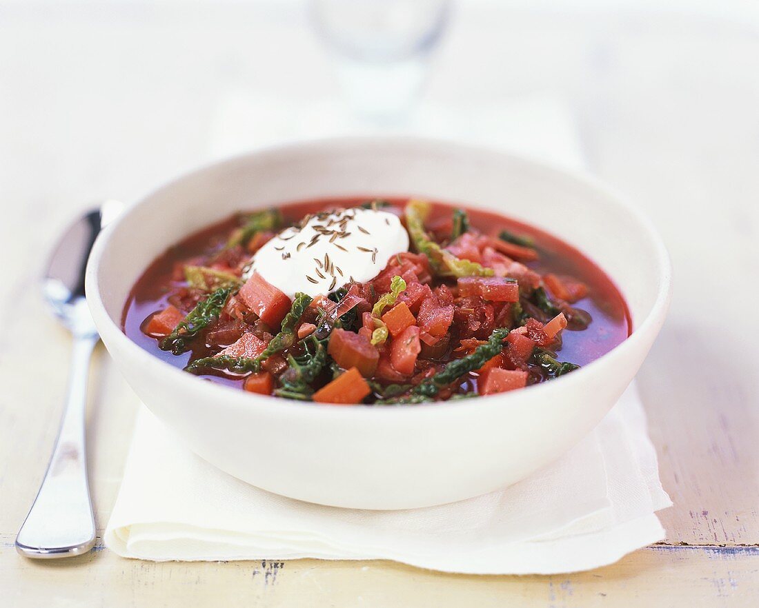 Tomato soup with savoy cabbage, sour cream and caraway