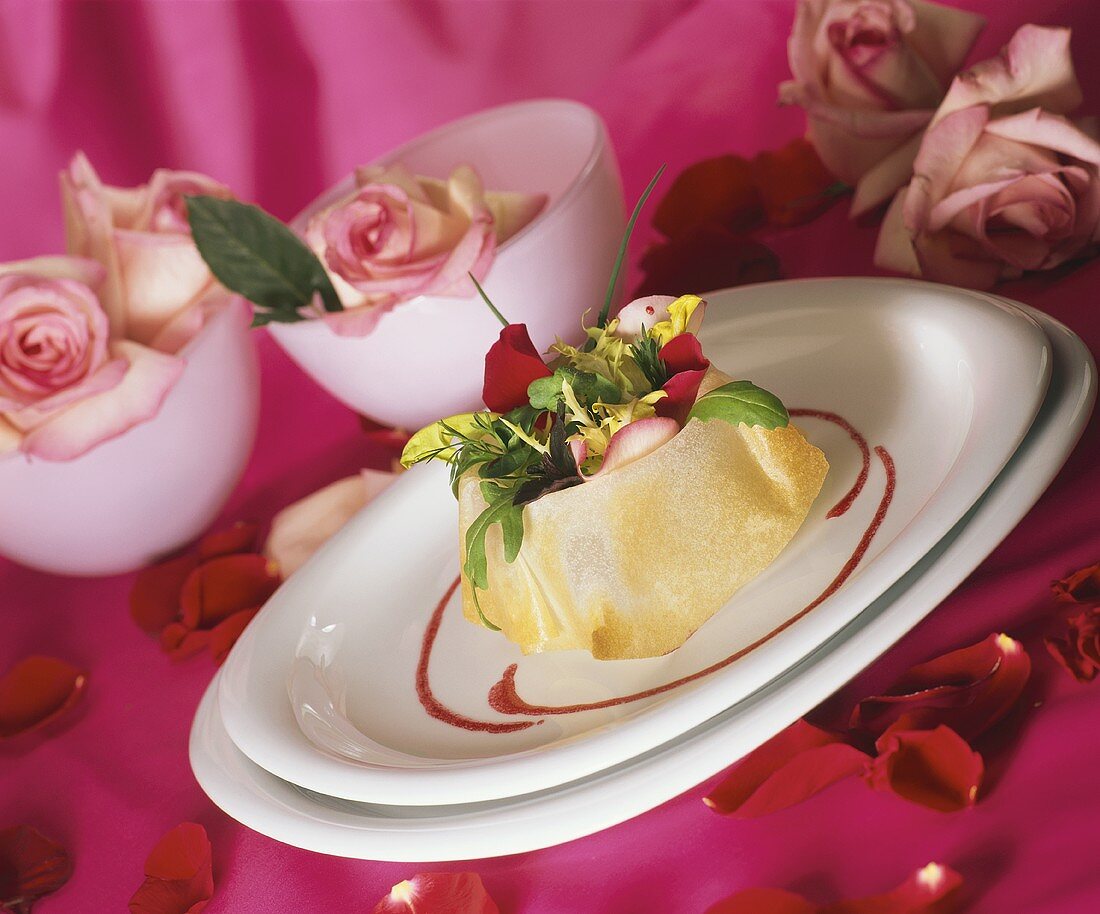 Green salad with rose petals in filo pastry shell