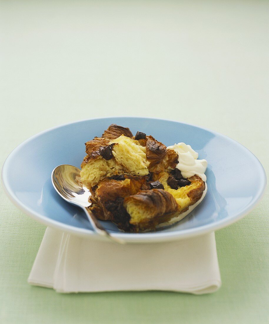 Chocolate croissant pudding with cream