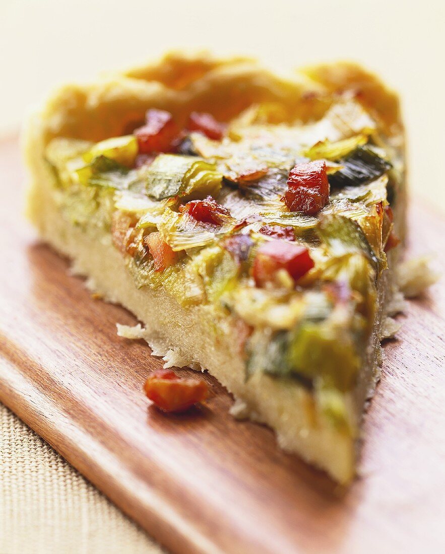 Piece of leek quiche with diced bacon