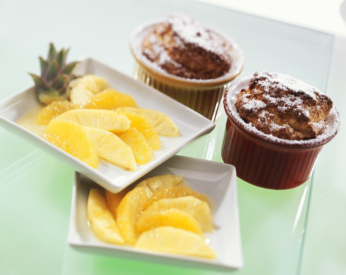 Coconut soufflés with fresh pineapple and oranges