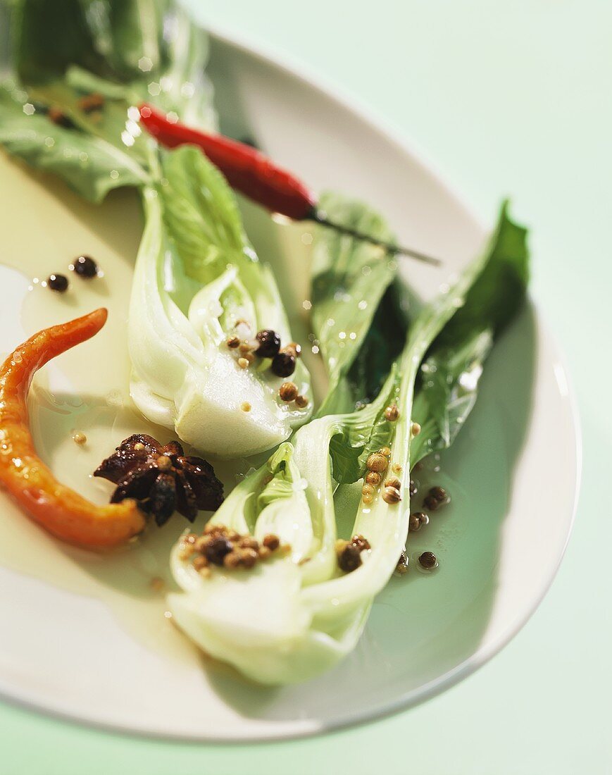 Marinated pak choi with spices and chili peppers