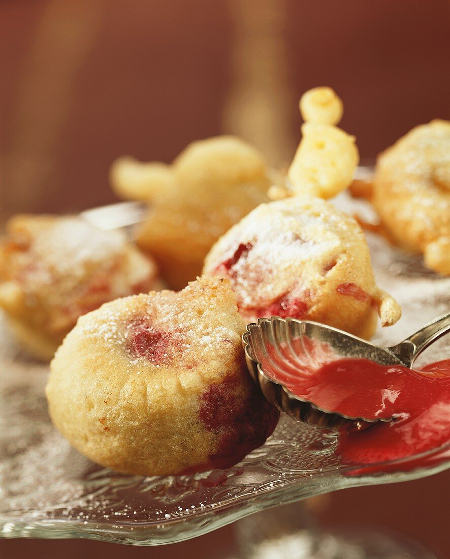 Plums in batter with icing sugar