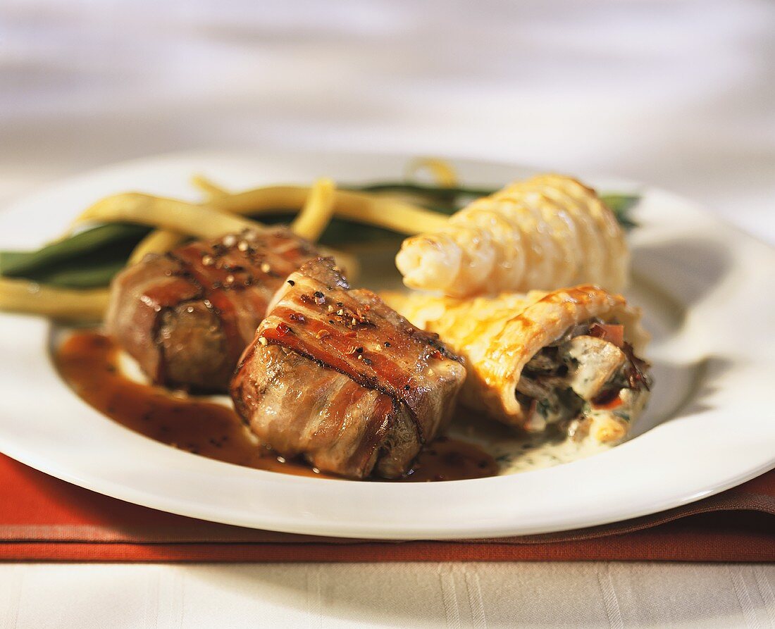 Beef fillets wrapped in bacon with brandy sauce