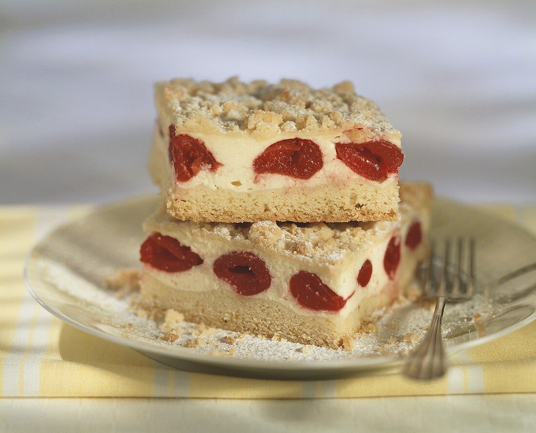 Two pieces of cherry crumble cake