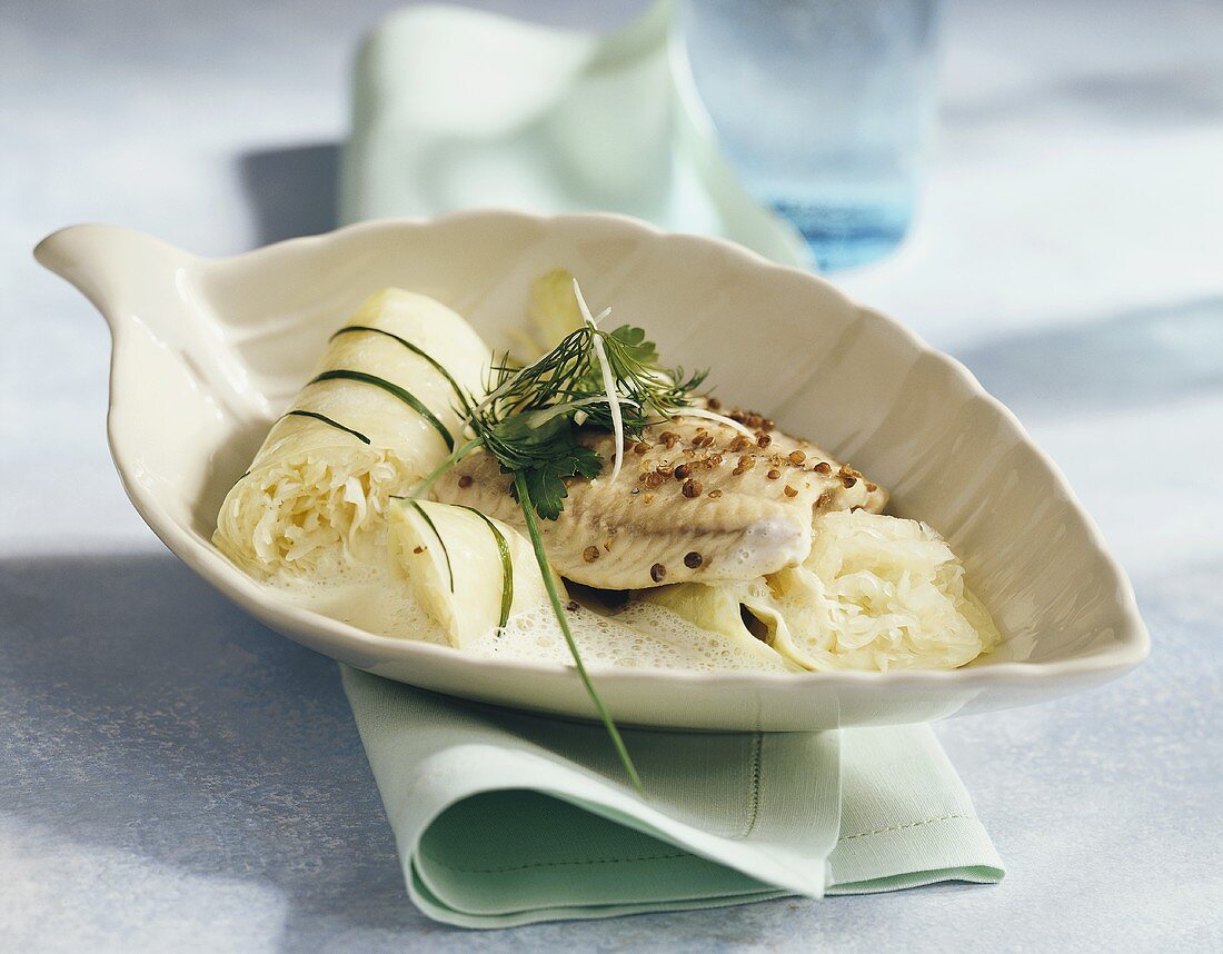 Steamed catfish fillet with sauerkraut roulades