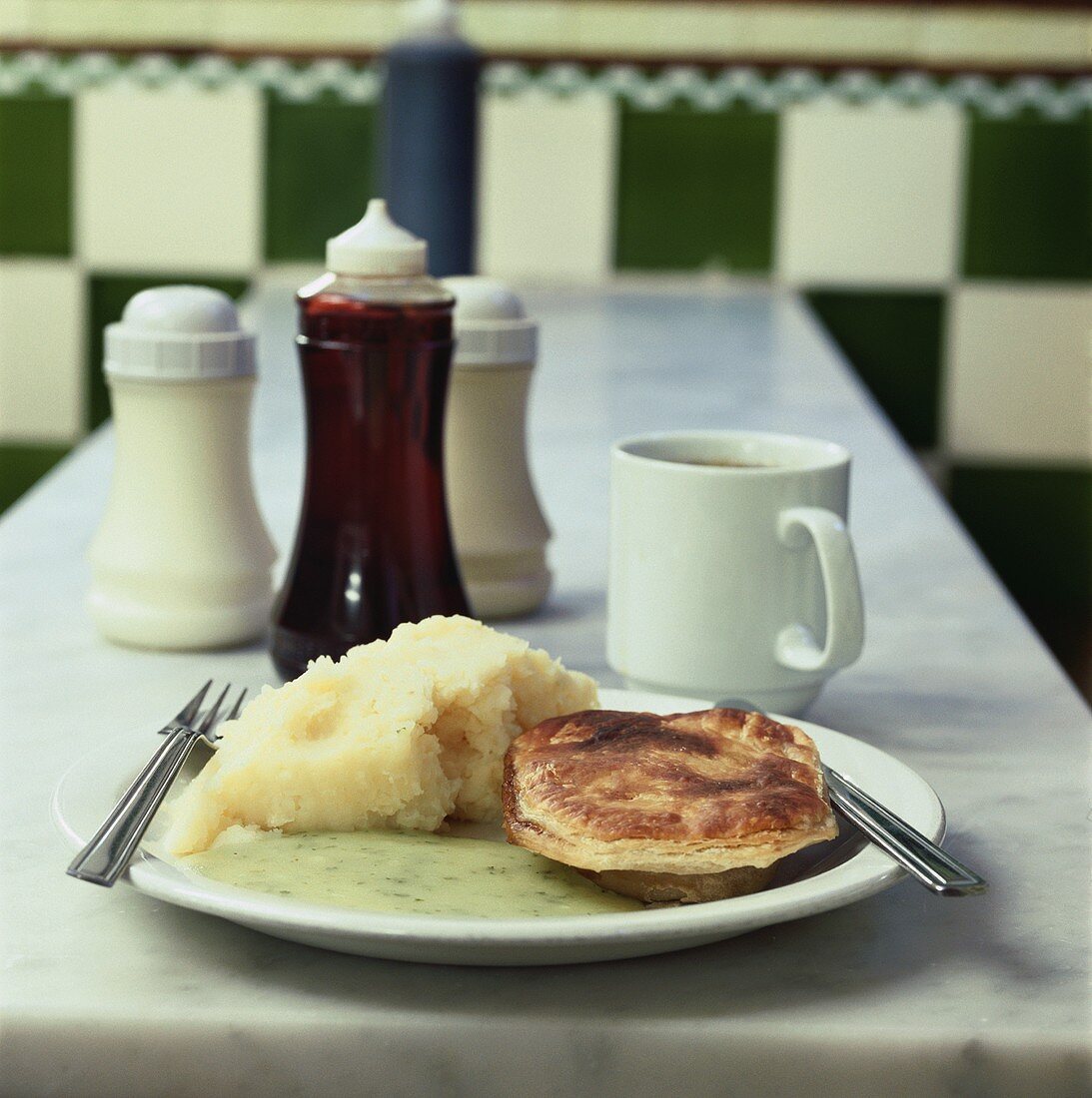 Pie and mash (Minced beef pie with mashed potato, England)