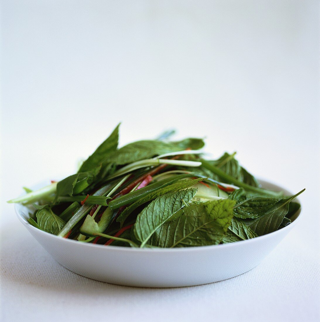 Ingredients for Asian salad with Thai basil on plate