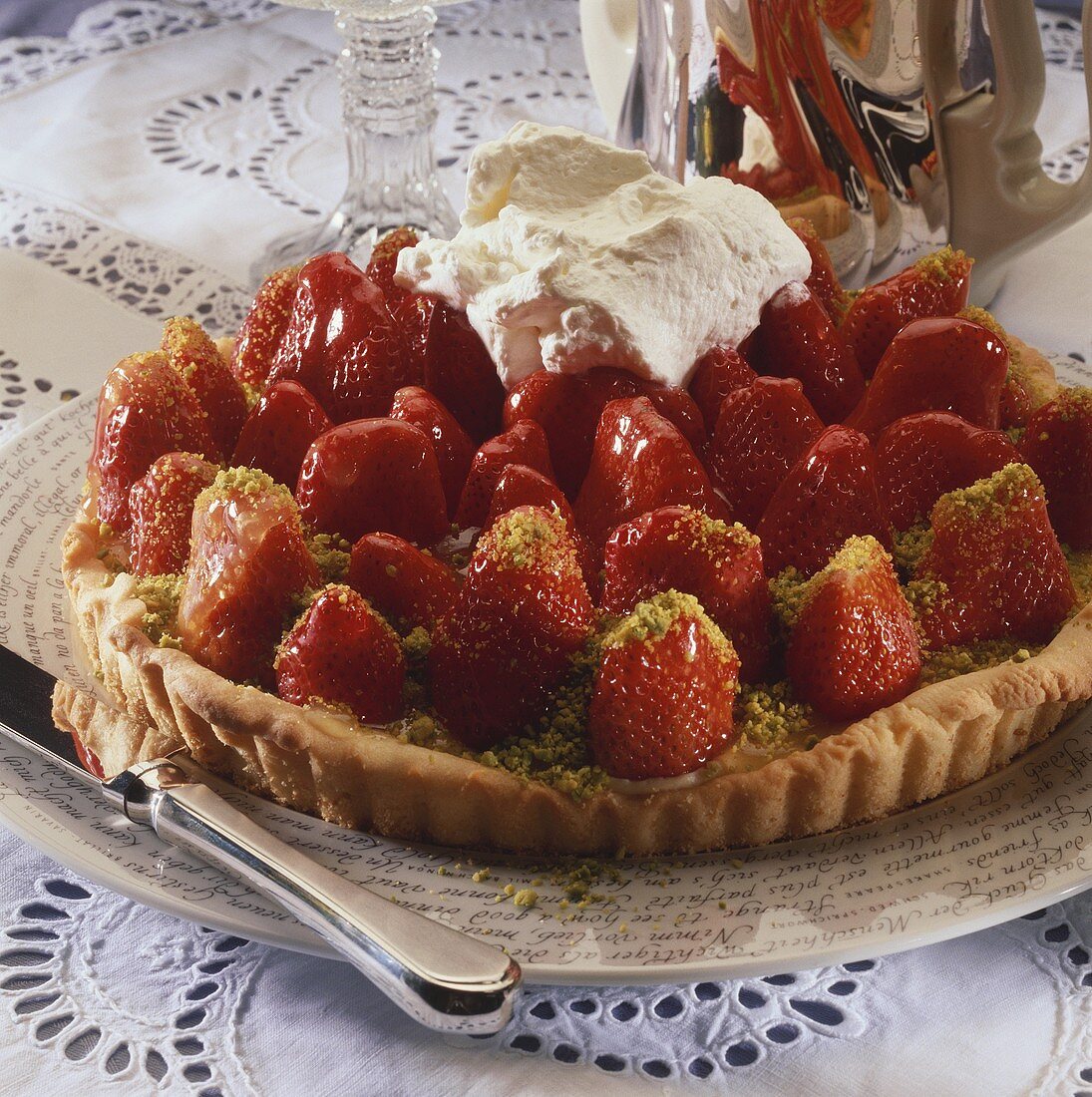 Strawberry tart with pistachios and cream