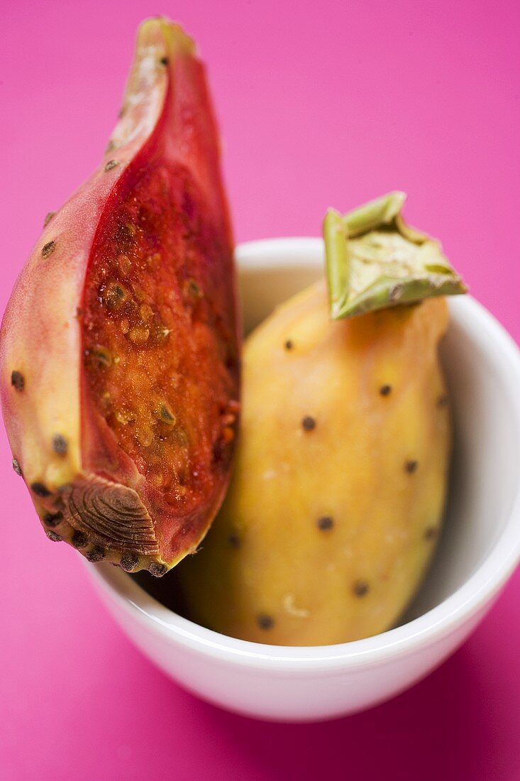 Whole and half prickly pear in bowl