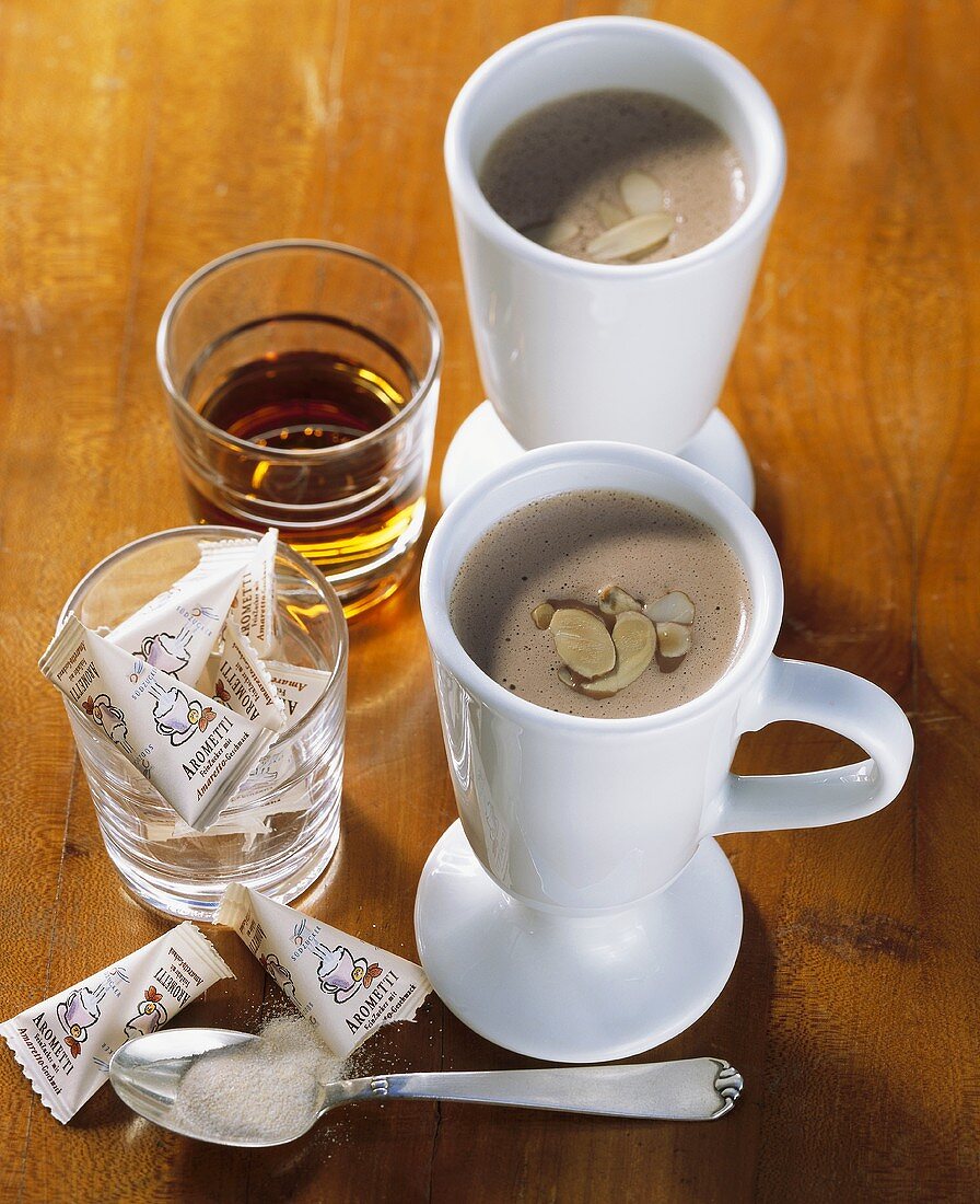 Hot chocolate with almonds and amaretto, packets of sugar