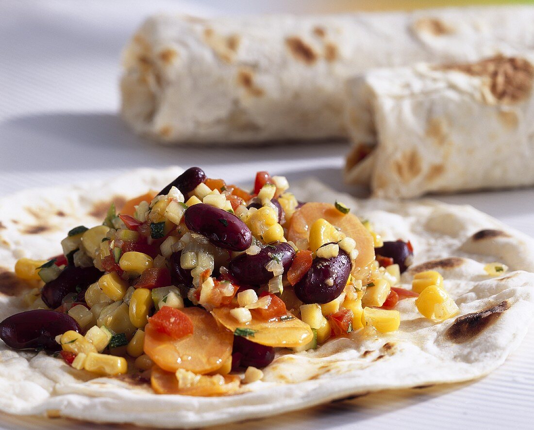 Wraps filled with sweetcorn, carrots and red kidney beans