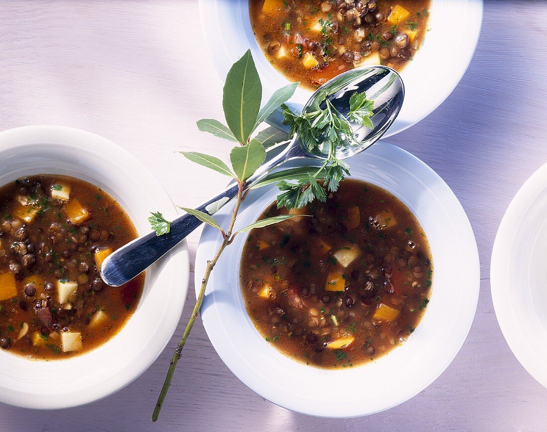 Three bowls of lentil soup (overhead view)