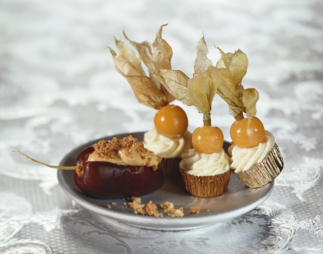 Stuffed date and sweets topped with physalis