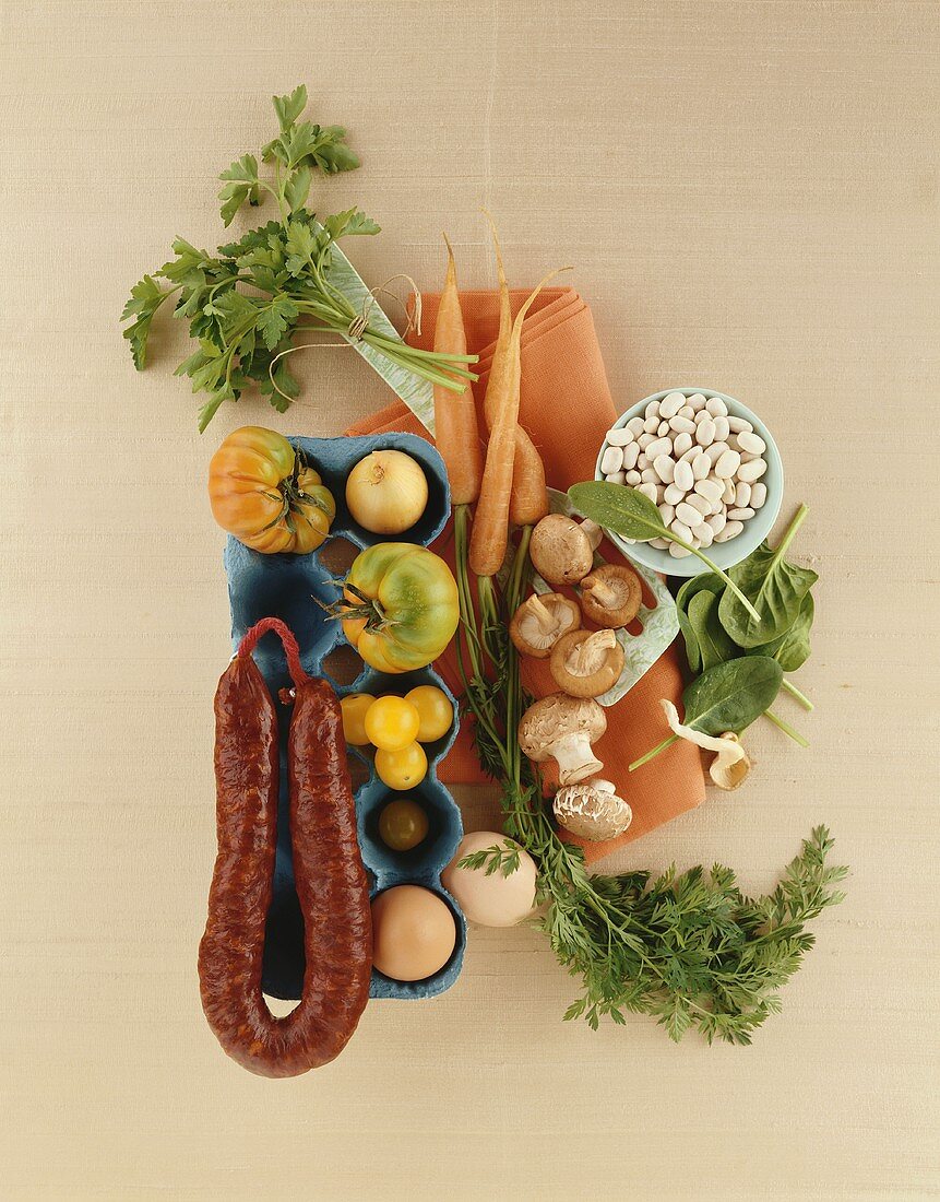 Still life with vegetables, mushrooms, sausage, eggs & herbs