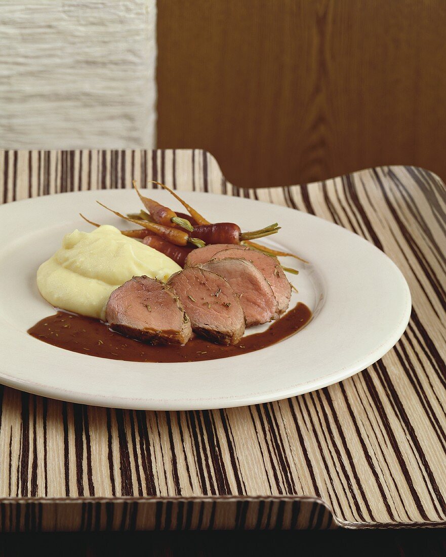 Pork fillet with rosemary, mashed potato and carrots
