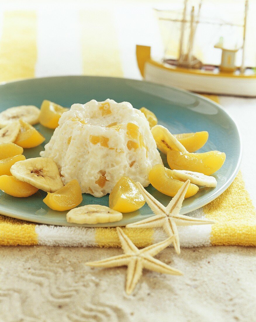 Rice pudding with bananas and apricots for children