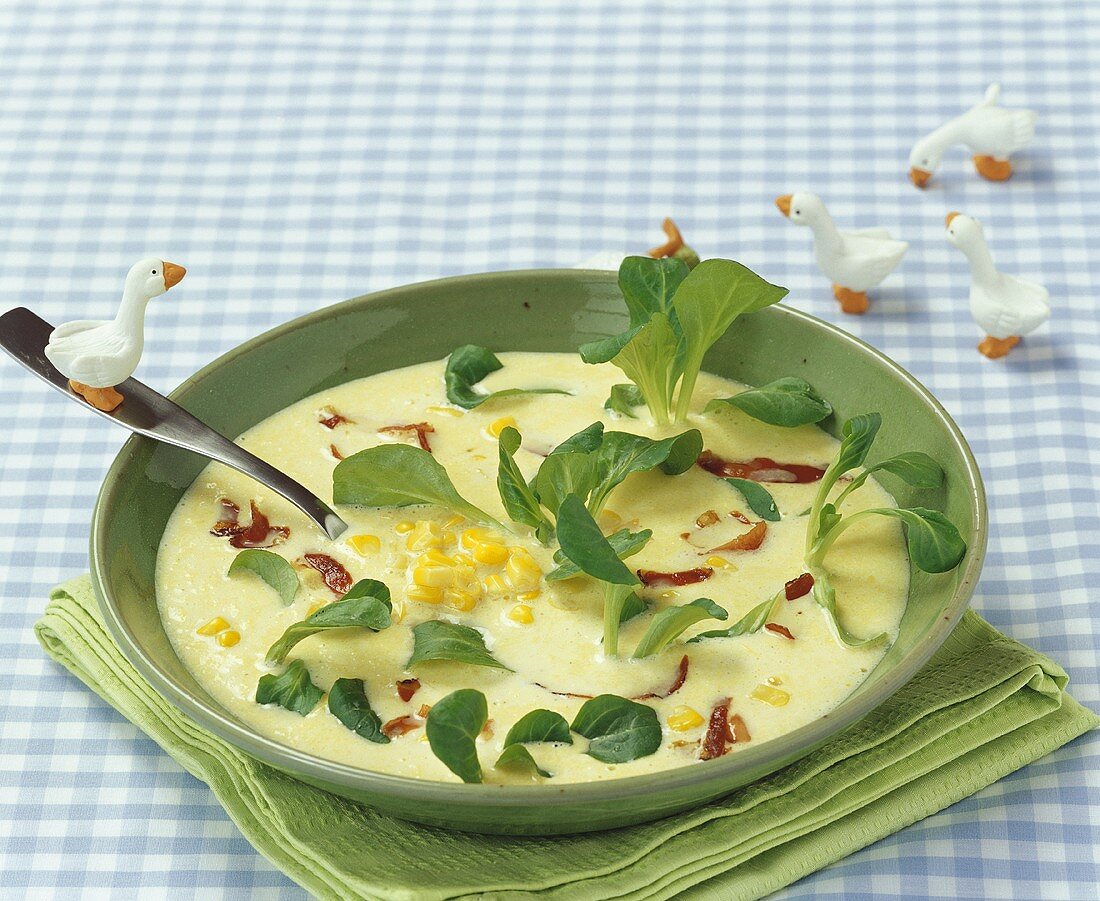 Creamed corn soup with bacon and corn salad for children
