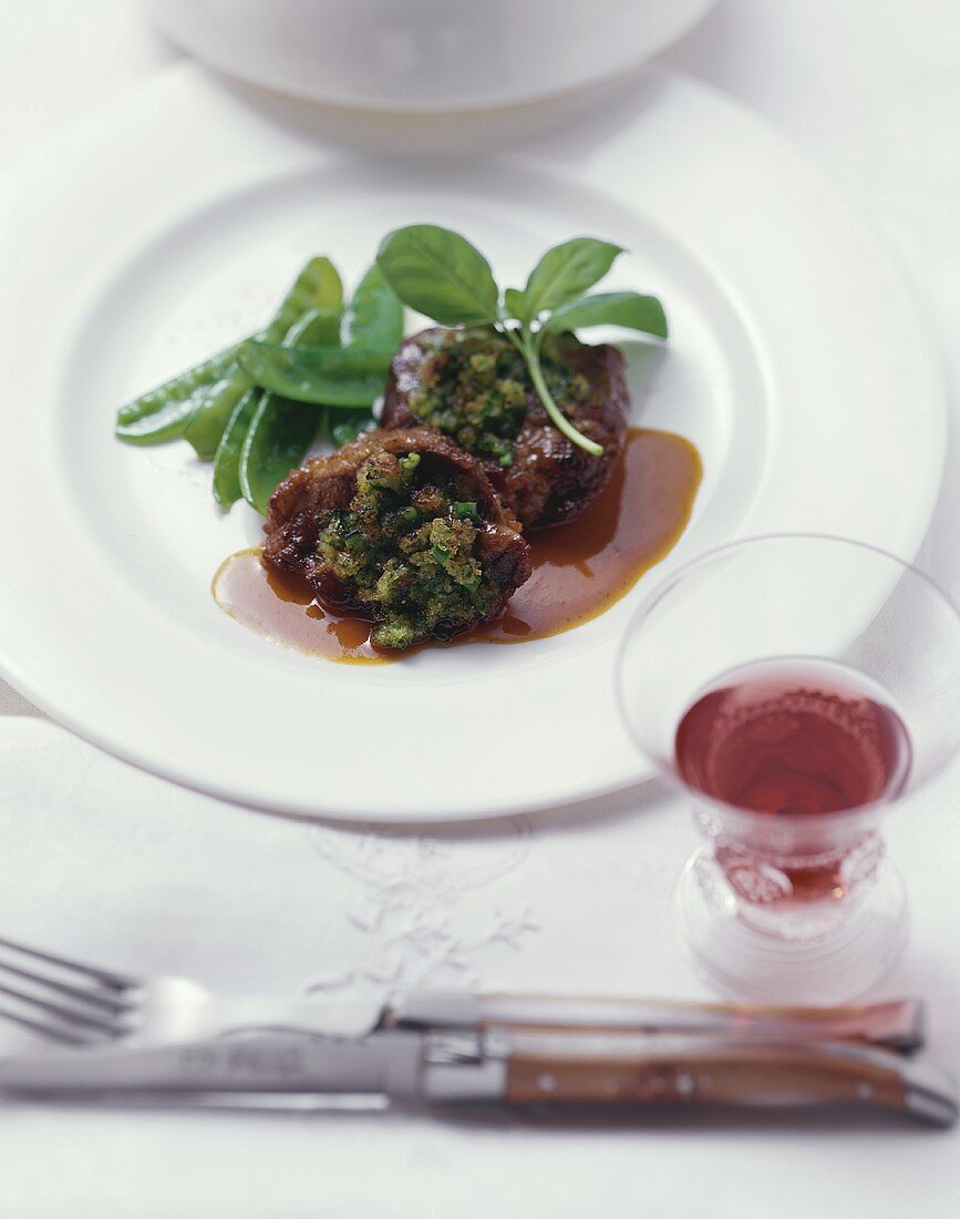 Braised veal cheeks with herbs and mangetout