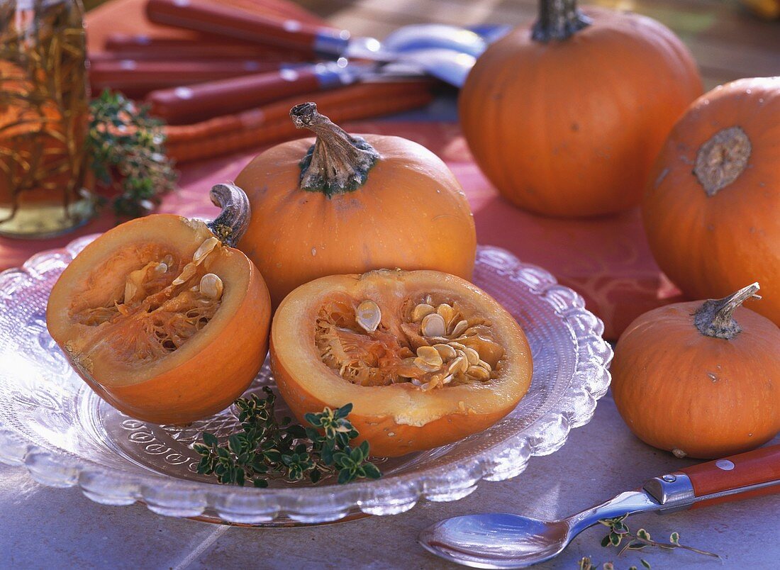 Orange pumpkins, whole and halved