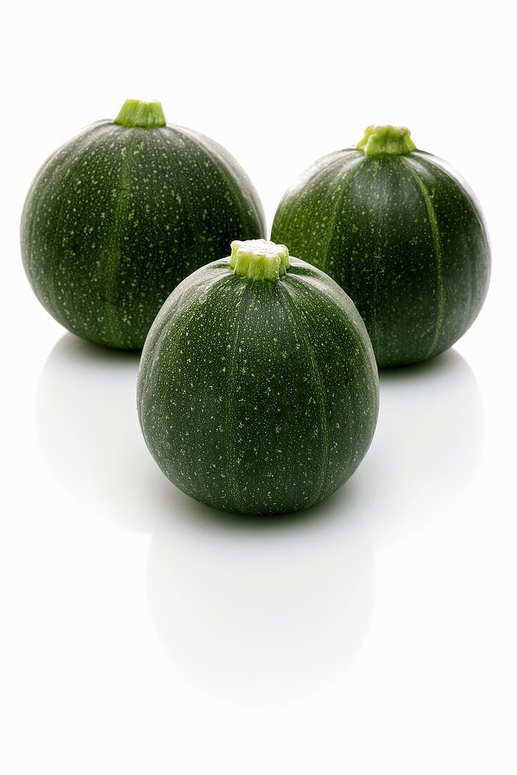 Three round courgettes