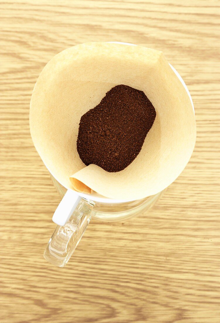 Ground coffee in coffee filter from above