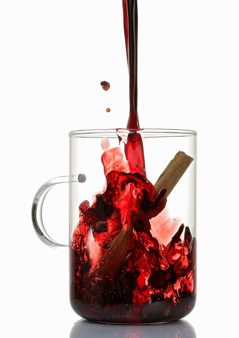 Pouring mulled wine into glass