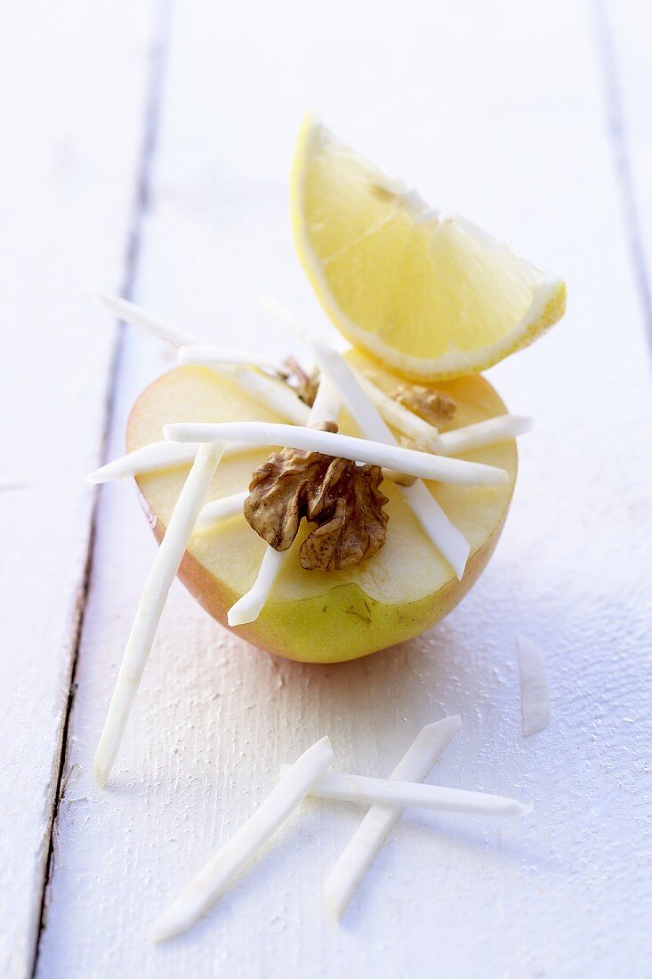 Raw apple and celeriac with walnut and lemon wedge