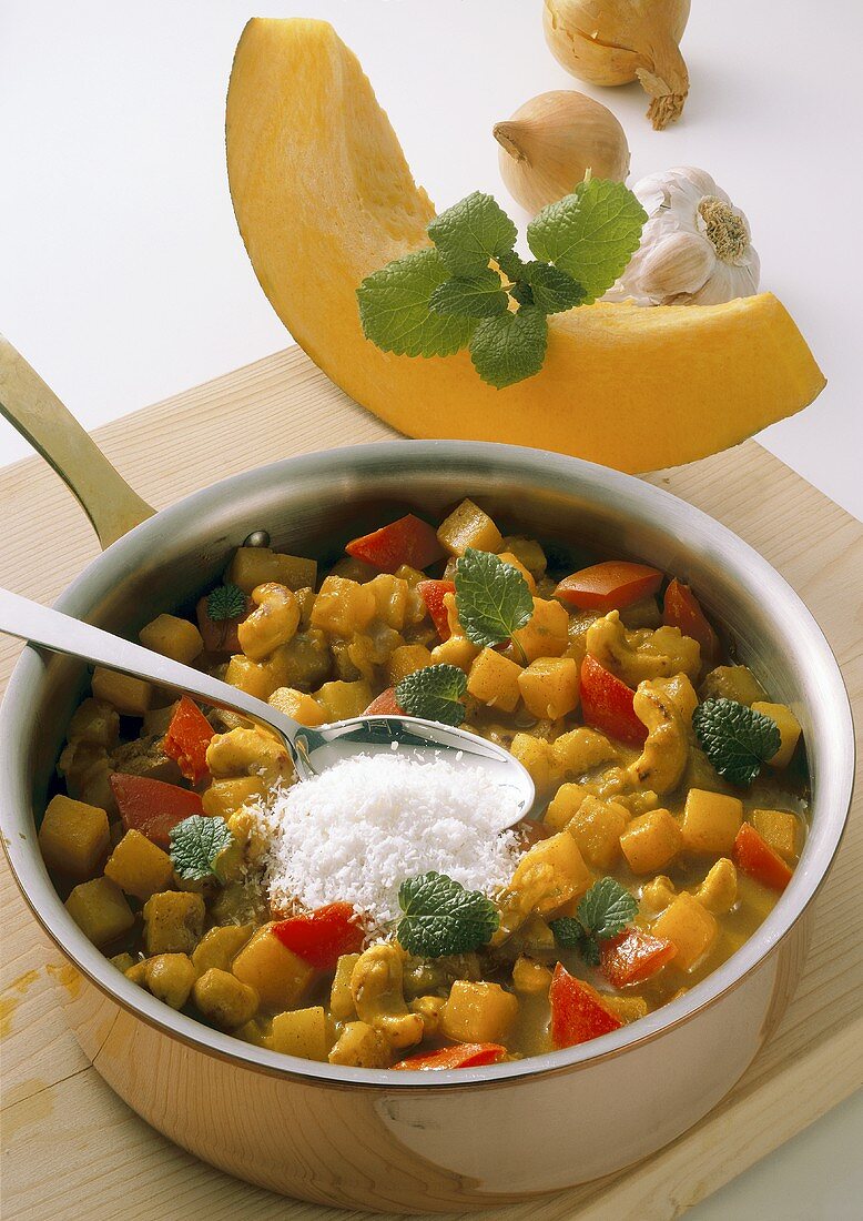 Pumpkin and potato curry with grated coconut