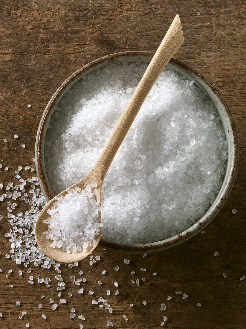 Coarse rock salt in bowl and on spoon